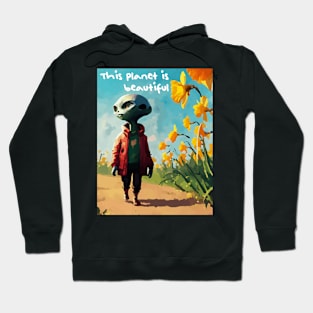 Alien walking through a vast field of yellow daffodils Hoodie